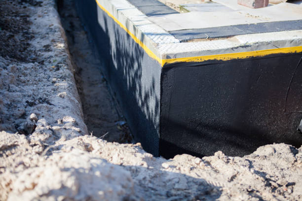 Professional Basement Waterproofing technician working in Sycamore, GA